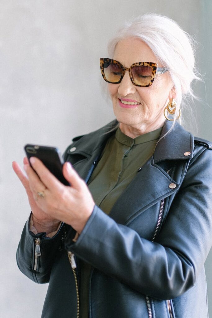 elderly woman checking smartphone