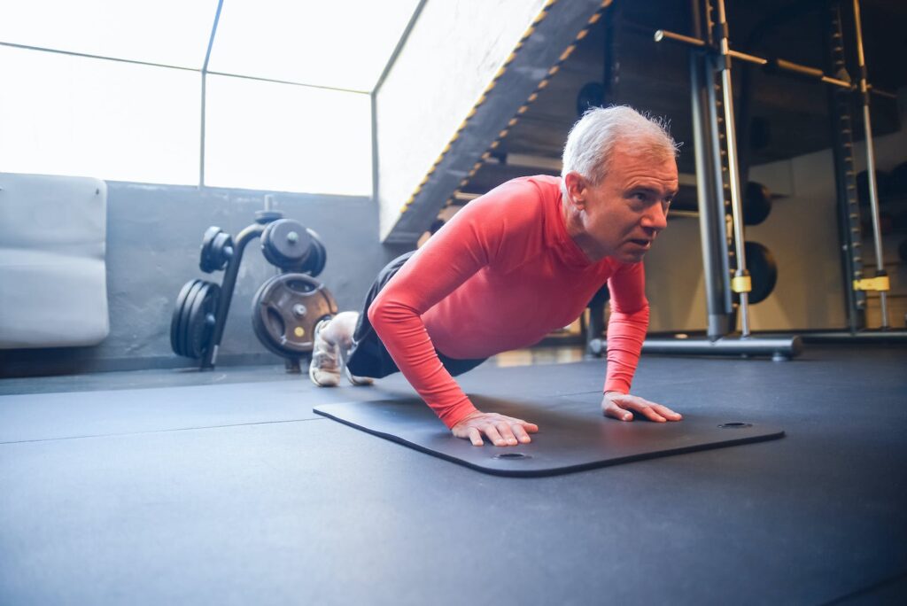 Man Doing Push Up at the Gym