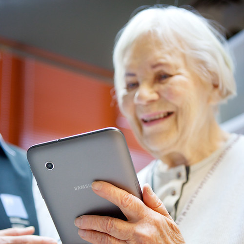 elderly woman with tablet