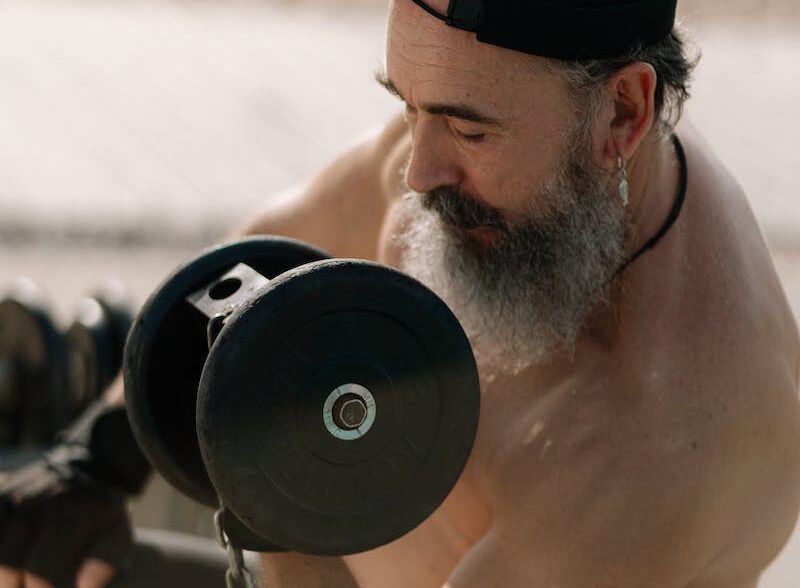 Senior Bearded Man Doing Weight Lifting