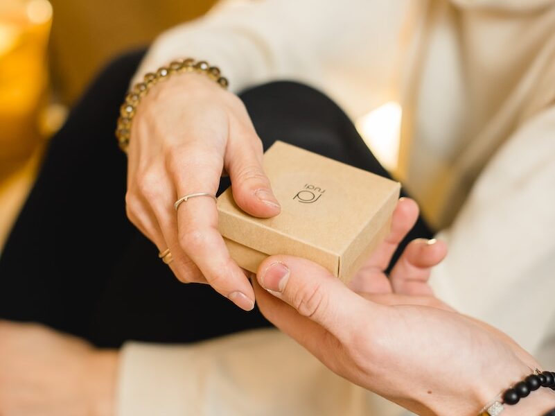 woman in white dress holding gold iphone 6