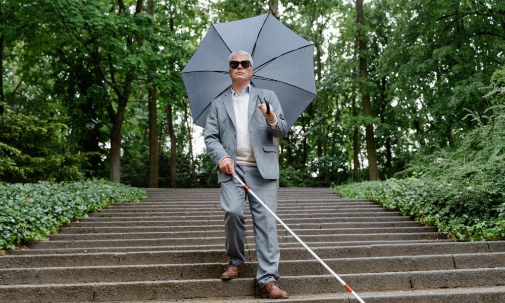 Blind Senior Walking Down the Stairs