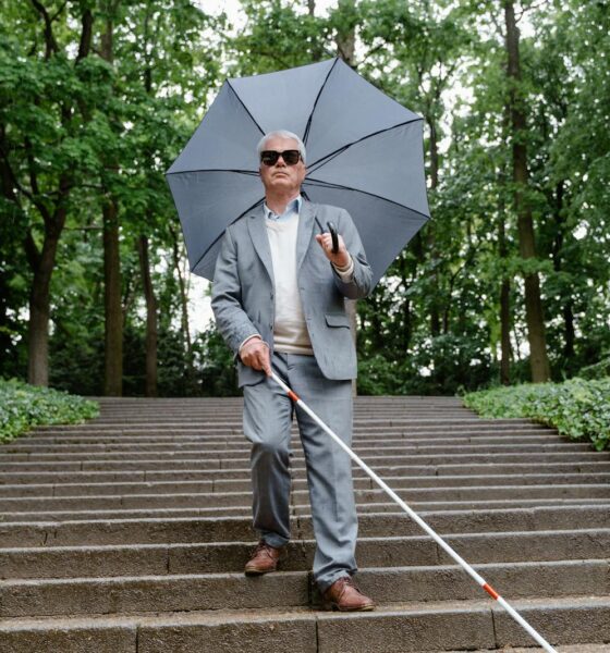 Blind Senior Walking Down the Stairs